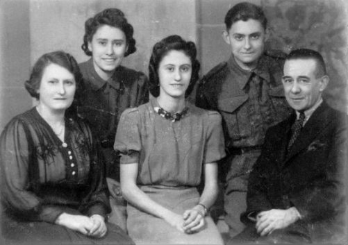 Elsie Louise Shaw née Mitten (1898-1968) and husband Herbert Shaw, with their three children between them: from left to right Doreen (1920-1959), Vera Shaw (born 1919) and John Shaw (1922-1992) in uniform